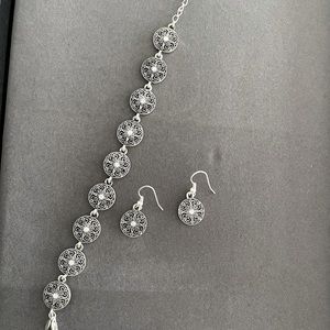 Beautiful intricate disc bracelet & earrings set with Cz stone. Never worn.